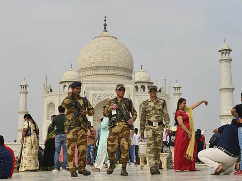 Central Industrial Security Force personnel patrol in the premises of Taj Mahal ahead of US President Donald Trump’s maiden visit to India, in Agra, Saturday.