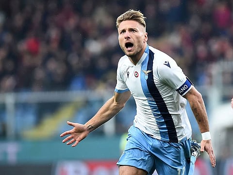 Lazio's Ciro Immobile celebrates scoring their second goal against Genoa during their Serie match at the Stadio Comunale Luigi Ferraris, in Italy.