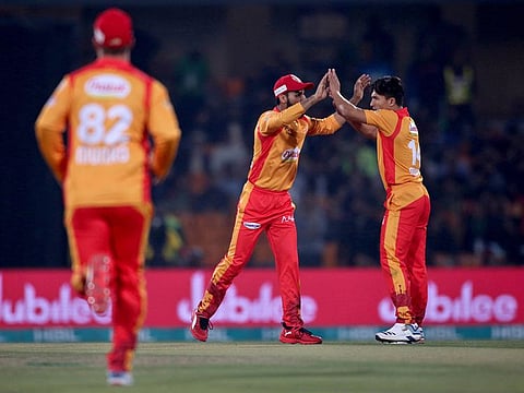 Islamabad United pacer Muhammad Musa, right, celebrates with Shadab Khan