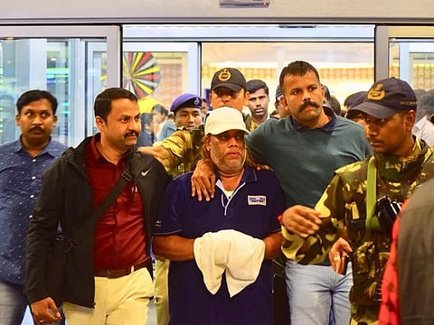 Ravi Pujari (in white cap), accused of committing serious offences including murder and extortion, reaches Bengalury airport.