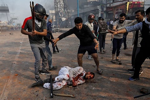 SENSITIVE MATERIAL. THIS IMAGE MAY OFFEND OR DISTURB    People supporting the new citizenship law beat a Muslim man during a clash with those opposing the law, in New Delhi, India, February 24, 2020. REUTERS/Danish Siddiqui