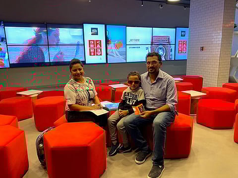 Mahmoud Mohamed Elsayed Basha with his wife and son at Radisson RED