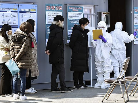 People suspected of having been infected with the coronavirus wait to receive tests at a medical centre in Daegu, South Korea, on February 20.