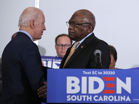House Majority Whip, Jim Clyburn, greets Democratic presidential candidate and former Vice-President Joe Biden, as he endorses him in North Charleston, South Carolina on Wednesday.