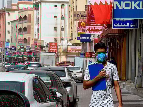 A man wearing a surgical mask is pictured in the heart of the Bahraini capital Manama on February 26, 2020.