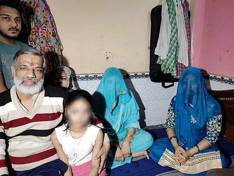 Rajkumar Bhardwaj (L) brought the family to Gautampuri in the early hours on February 25