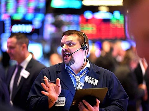 Traders at the New York Stock Exchange (NYSE). US stocks climbed to all-time highs and Treasury yields jumped after a report showing US employment gains slowed in November bolstered expectations for more federal stimulus.