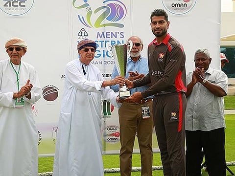 UAE captain Ahmad Raza received the Asian Cricket Council Western Region T20 tournament trophy from Kanak Khimji, Chairman of Oman Cricket and Sultan Rana, ACC’s Events and Development Manager. Picture: ACC