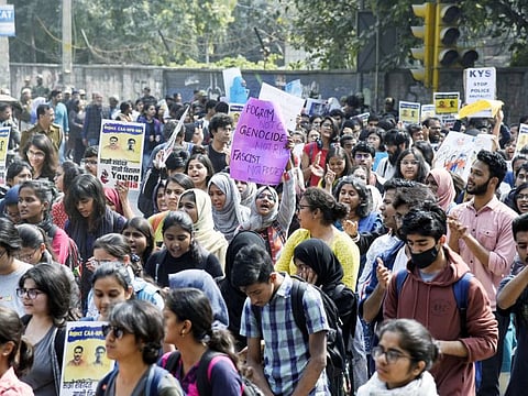 New Delhi, Feb 28 (ANI): Delhi University students holding placards stage protest against the communal violence in north eastern Delhi, in New Delhi on Friday. (ANI Photo)