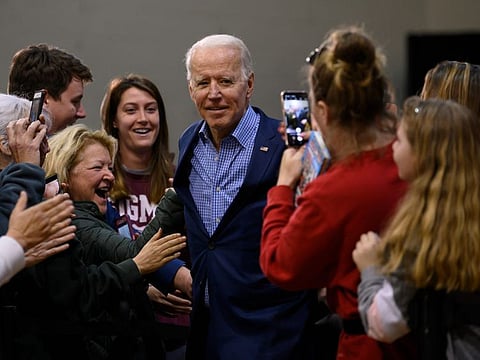 Supporters cheer as Democratic presidential hopeful former Vice President Joe Biden (C) arrives to speak at a rally in Conway, South Carolina, on Thursday.