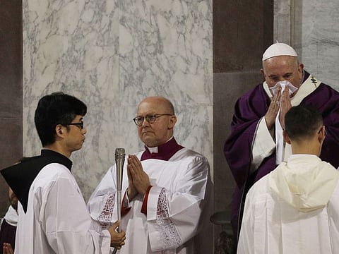 Pope Francis wipes his nose as he celebrates the Ash Wednesday Mass opening Lent, in the Santa Sabina Basilica, in Rome, on Wednesday. Pope Francis celebrated the Ash Wednesday ritual kicking off the Catholic Church's Lenten season in traditional fashion, while other Masses in northern Italy were cancelled over fears of the new coronavirus.