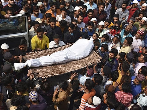 The body of a victim of communal violence is brought home to Old Mustafabad neighborhood of New Delhi, India, Saturday, Feb. 29, 2020. On the eve of U.S. President Donald Trump's first state visit to India last Sunday, Hindus and Muslims in the Indian capital charged at each other with homemade guns and crude weapons, leaving the streets where the rioting occurred resembling a war zone, with houses, shops, mosques, schools and vehicles up in flames, more than 40 dead and hundreds injured. Authorities haven't said what sparked it, but the violence was the culmination of growing tensions since the passage of a citizenship law in December that fast-tracks naturalization for some religious minorities from neighboring countries but not Muslims. (AP Photo/Dinesh Joshi)