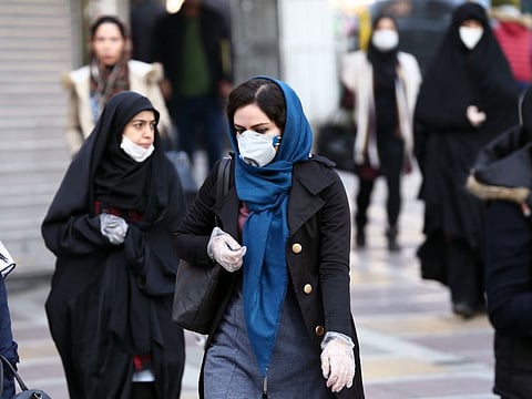 Iranian people wear protective masks to prevent contracting a coronavirus, in Tehran, Iran February 29, 2020. WANA (West Asia News Agency)/Nazanin Tabatabaee via REUTERS ATTENTION EDITORS - THIS PICTURE WAS PROVIDED BY A THIRD PARTY