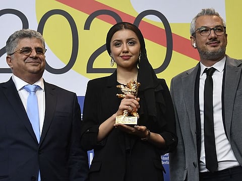 (L to R) Iranian producer Kaveh Farnam, Iranian actress Baran Rasoulof and Iranian producer Farzad Pak on behalf of Iranian director Mohammad Rasoulof who was awarded the "Golden Bear for Best Film" attend a press conference after the awarding ceremony of the 70th Berlinale film festival in Berlin on February 29, 2020.