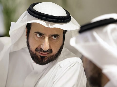 Saudi health minister Tawfiq Al Rabiah, talks to a health official as he discuss the latest situation on coronavirus at the Saudi Food and Drug Authority in Riyadh February 27.