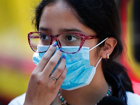 A teen wears a mask as a precaution against the spread of the new coronavirus, during an outing in Mexico City on February 29, 2020.