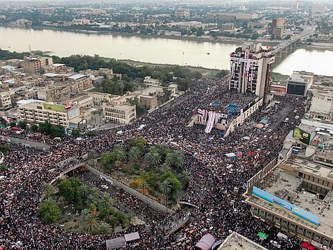 Iraqi protesters gathering at Baghdad's Tahrir square near al-Jumhuriya bridge which leads to the high-security Green Zone across the Tigris River, during ongoing anti-government demonstrations in the Iraqi capital.