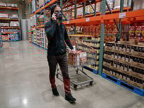 Kingsley Northcott shops for nonperishable groceries at Costco on Sunday, March 1, 2020, in Kirkland, Washington, where officials are monitoring a possible coronavirus outbreak.