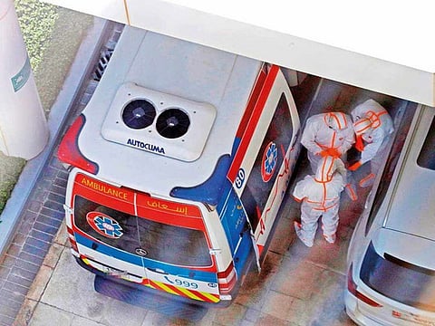 An ambulance and emergency medical response team on the scene, where two Italian cyclists participating in the UAE Tour tested positive for coronavirus virus.