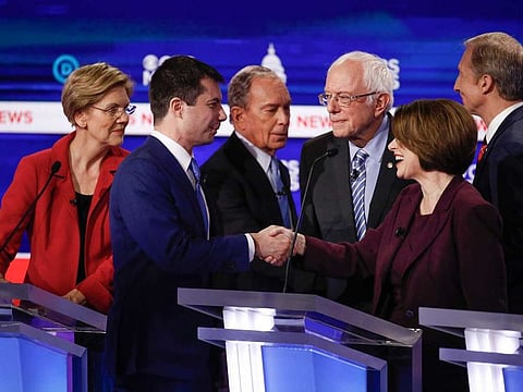 Democratic presidential candidates, Sen. Elizabeth Warren, former South Bend Mayor Pete Buttigieg, former New York City Mayor Mike Bloomberg, Sen. Bernie Sanders, Sen. Amy Klobuchar, and businessman Tom Steyer, greet one another on stage at the end of the Democratic presidential primary debate at the Gaillard Center February 25. Steyer and Buttigieg have since pulled out of the race.