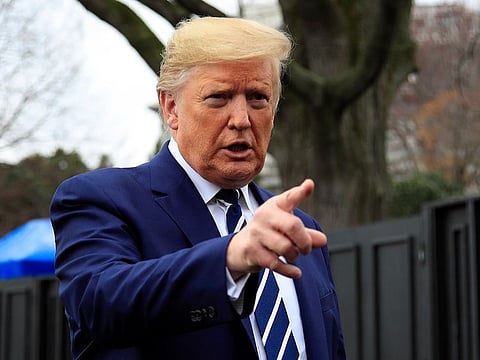President Donald Trump speaks to the media as he leaves the White House, Tuesday, March 3, 2020, in Washington, to visit the National Institutes of Health's Vaccine Research Center in Bethesda.