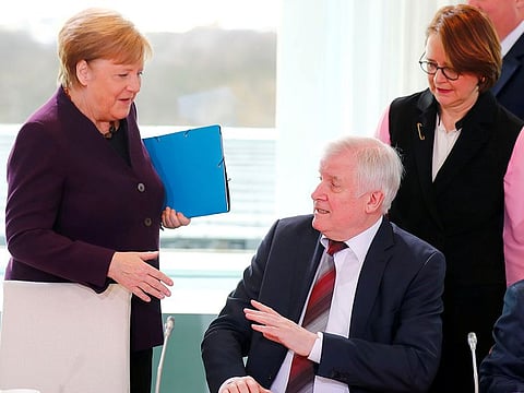 German Interior Minister Horst Seehofer refuses to shake the hand of German Chancellor Angela Merkel for hygienic reasons before a migration summit at the Chancellery in Berli