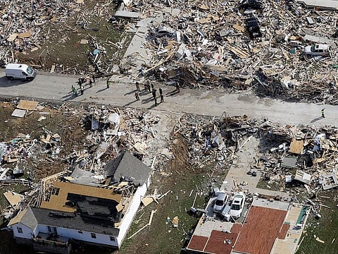 Emergency personnel work among destroyed homes Tuesday, March 3, 2020, near Cookeville, Tennessee.