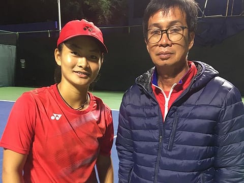 Priska Madelyn Nugroho (left) with Indonesia's Fed Cup coach Deddy Tedjamukti during their campign in Dubai in March before all sporting activities were halted.