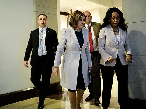 House Speaker Nancy Pelosi leaves a briefing about coronavirus in Washington on Wednesday, March 4, 2020.