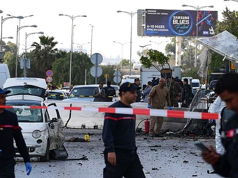 Police and firefighters gather at the scene of an explosion near the US embassy in the Tunisian capital Tunis.
