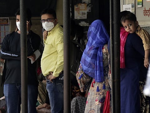 People wear masks at a hospital that also has a special ward set aside for possible coronavirus patients, in Mumbai on Thursday.