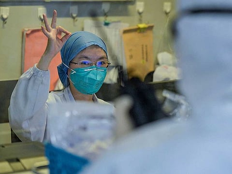 A doctor treat patients infected by the COVID-19 coronavirus at a hospital in Wuhan in China's central Hubei province