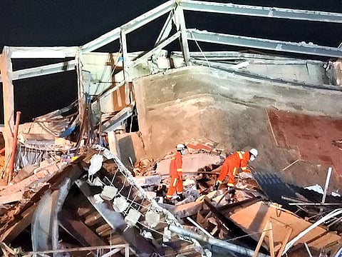 Rescue workers are seen on the site where a hotel being used for the novel coronavirus quarantine collapsed in the southeast Chinese port city of Quanzhou, Fujian province, China March 7, 2020.