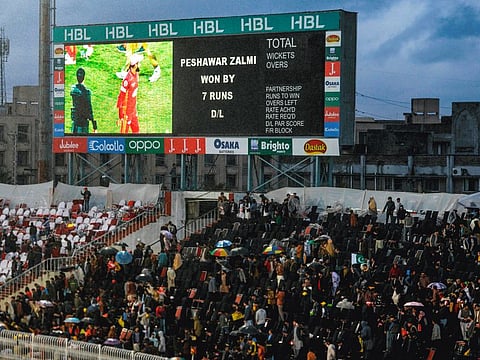 Spectators leave the terraces after the announcement of Duckworth-Lewis win by Peshawar Zalmi in their Pakistan Super League match against Islamabad United in Rawalpindi on Friday night.