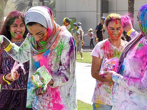 Indian community celebrating holi at Zabeel Park in Dubai.