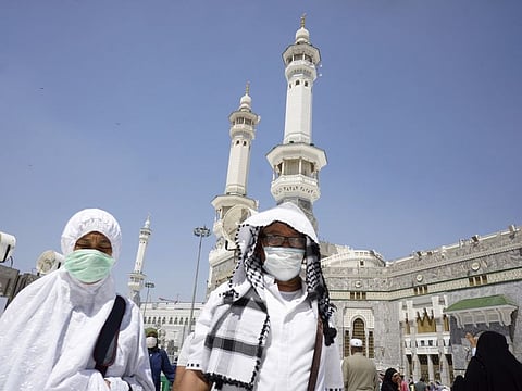The faithful after the noon prayers outside the Grand Mosque in Mecca, Saudi Arabia, on March 7.