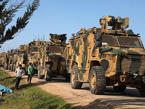 A Turkish military convoy is seen parked near the town of Batabu near Idlib. In Syria, Erdogan has supported the mostly Islamist rebels with arms and training.