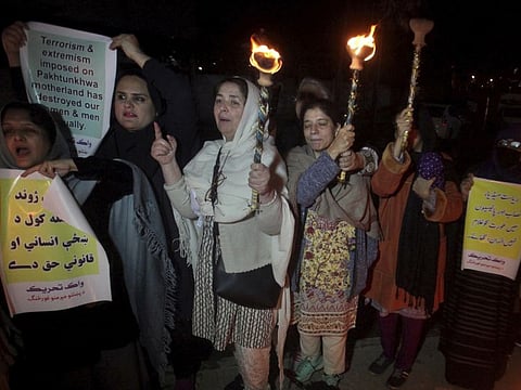 Members of a civil society take party in a pro-women demonstration ahead of Women's Day in Peshawar, Pakistan, Saturday.