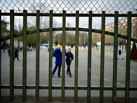 Young students play in a public school, in Vitoria, northern Spain, Monday, March 9, 2020.