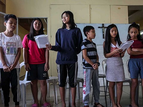Children - including those who have lost a parent in alleged extrajudicial killings - attend a choir session as part of the Project Support Orphans and Widows (SOW) rehabilitation programme in Payatas.
