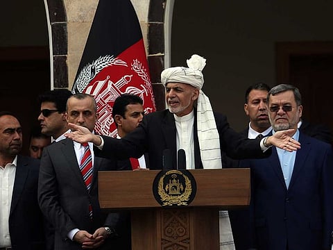Afghan President Ashraf Gani speaks after a few rockets were fired during his speech after he was sworn in at an inauguration ceremony at the presidential palace in Kabul on Monday.