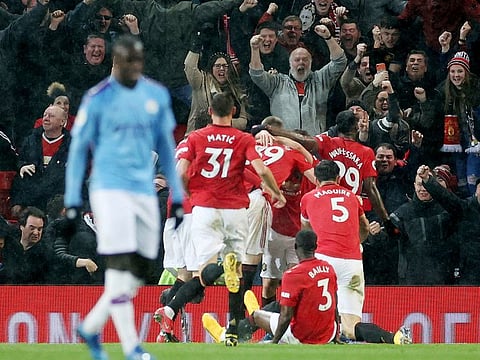 Manchester United celebrate their win over CIty