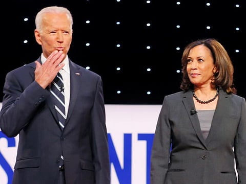 Former Vice-President Joe Biden and US Senator Kamala Harris take the stage on the second night of the second 2020 Democratic U.S. presidential debate in Detroit on July 31, 2019.  Harris has endorsed Biden as the Democratic presidential candidate.