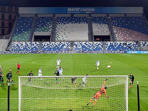 A view of the empty stands at the Mapei stadium as the Serie A soccer match between Sassuolo and Brescia is being played behind closed doors, in Reggio Emilia, Monday, March 9, 2020.