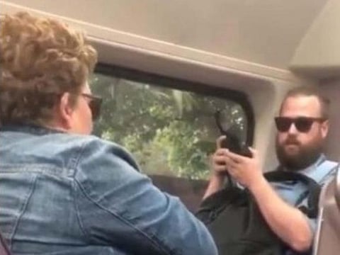 A video of a fight on a train in Australia between a man and woman because he asked her to cover her mouth when she coughs, goes viral