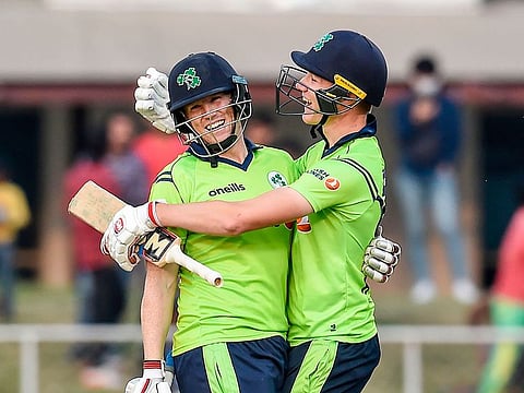 Ireland's Kevin O'Brien (L) and teammate Harry Tector celebrate after winning the third T20 between Afghanistan and Ireland in Greater Noida on March 10, 2020.