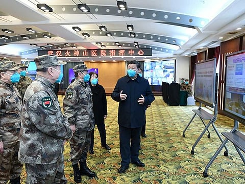 Chinese President Xi Jinping learns about the hospital's operations, treatment of patients, protection for medical workers and scientific research at the Huoshenshan Hospital in Wuhan, the epicentre of the novel coronavirus outbreak, Hubei province, on March 10.