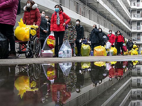 People recovered from coronavirus prepare to leave the rehabilitation center after a 14-day quarantine for medical observation in Wuhan in central China's Hubei province.