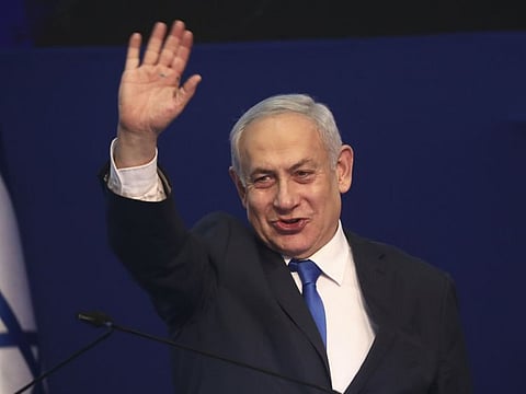Israeli Prime Minister Benjamin Netanyahu addresses his supporters after first exit poll results for Israeli elections in Tel Aviv