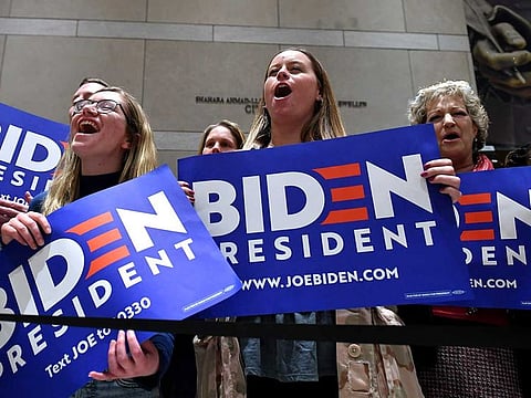 Supporters of Democratic presidential candidate Joe Biden cheers as he speaks at the National Constitution Center in Philadelphia, Pennsylvania on March 10, 2020.